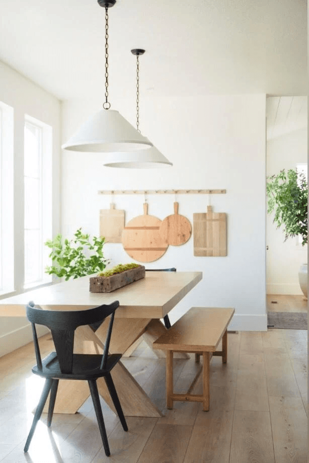 Dome pendant lights installed over a dining nook by High Desert Electric
